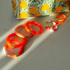 Boucles d'oreilles Bola Riviera Laranja Parabaya